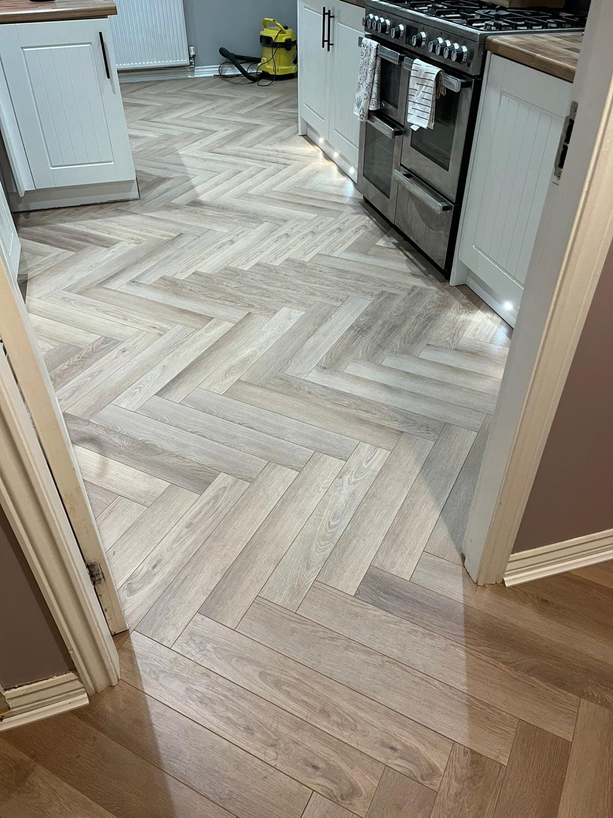 Ambassador Oak 12mm Herringbone Laminate