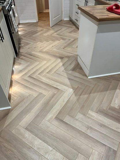 Ambassador Oak 12mm Herringbone Laminate