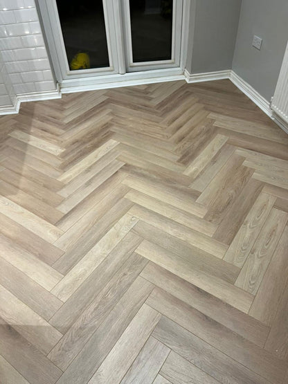 Ambassador Oak 12mm Herringbone Laminate