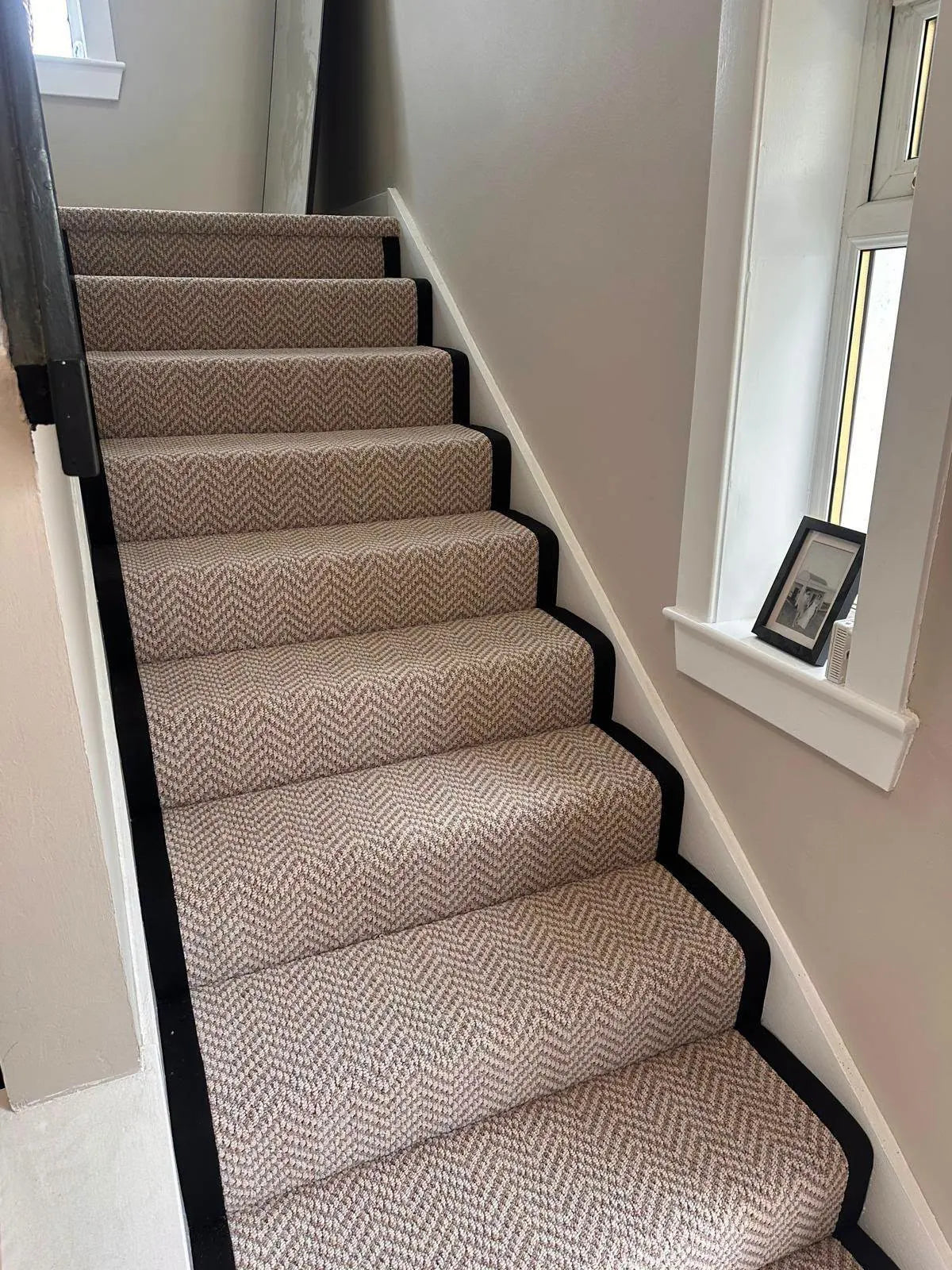 Textured carpet fitted wall to wall on a staircase